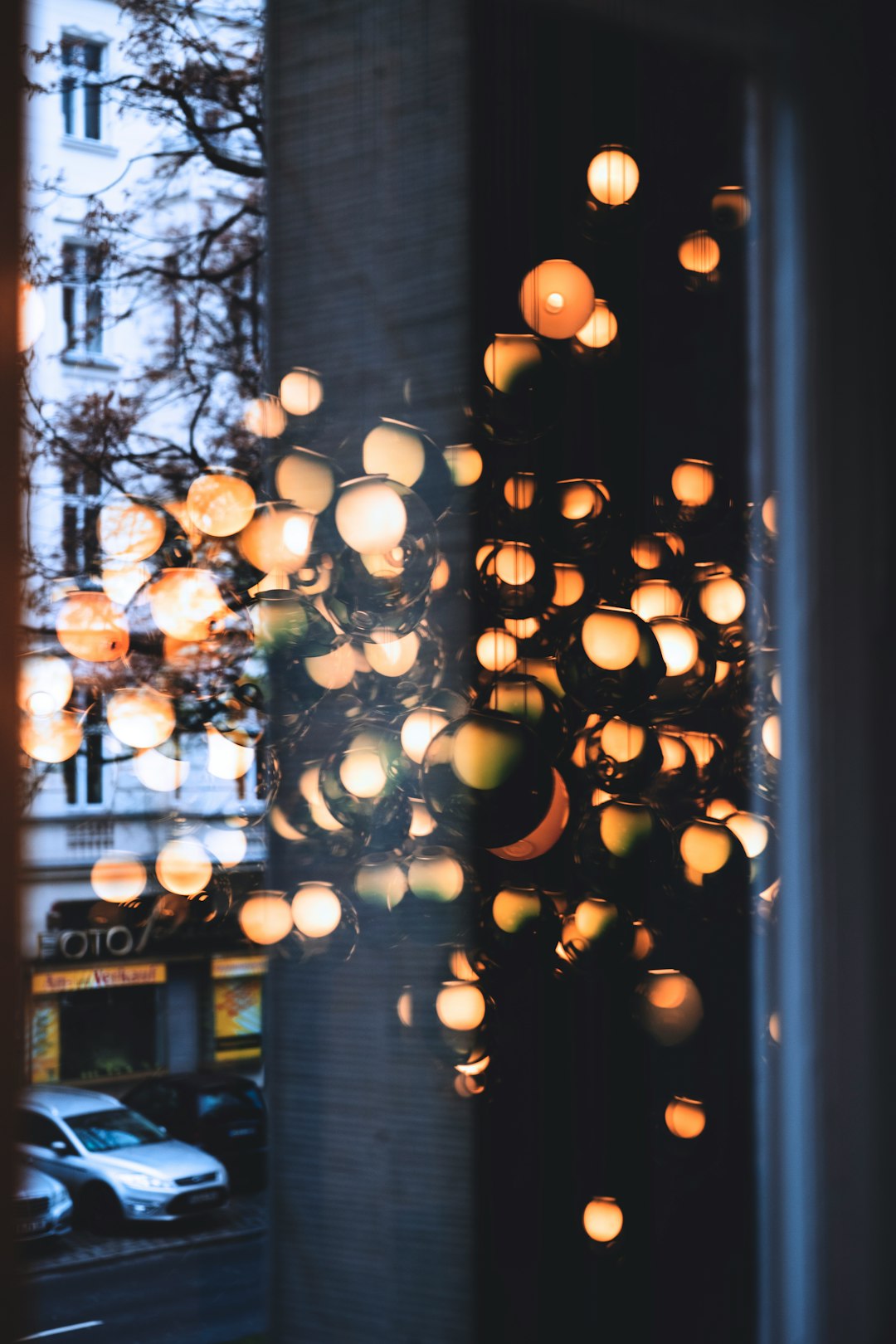 orange light bulbs turned on inside glass room