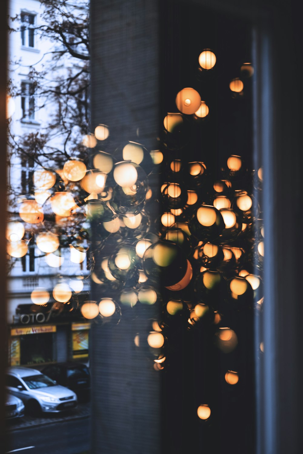 orange light bulbs turned on inside glass room