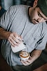 man in gray crew-neck T-shirt making cappuccino
