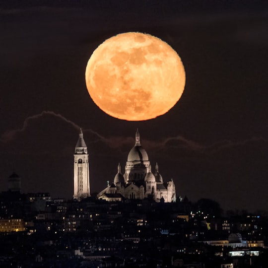 white mosque near city under full moon sky in Sacré-Cœur France