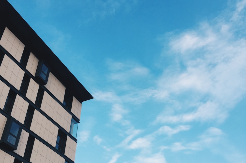 top view angle of white high-rise building under blue sky