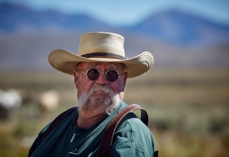 shallow focus of man wearing sunhat