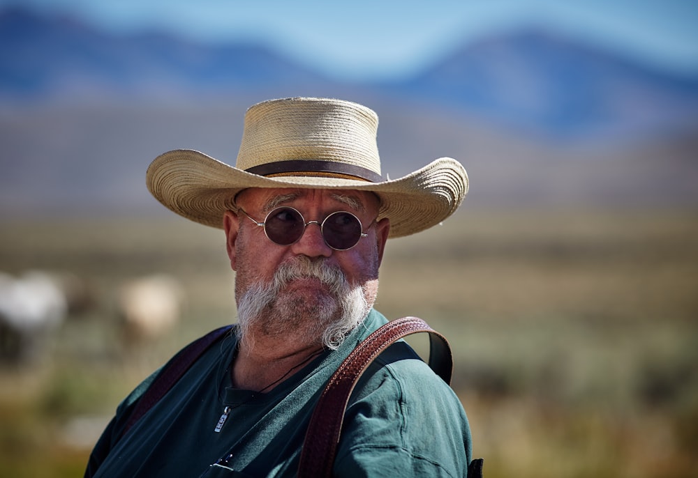 shallow focus of man wearing sunhat