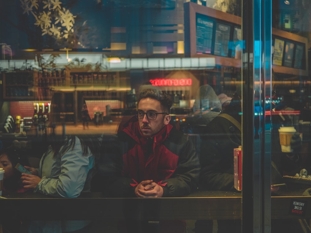 man leaning on table