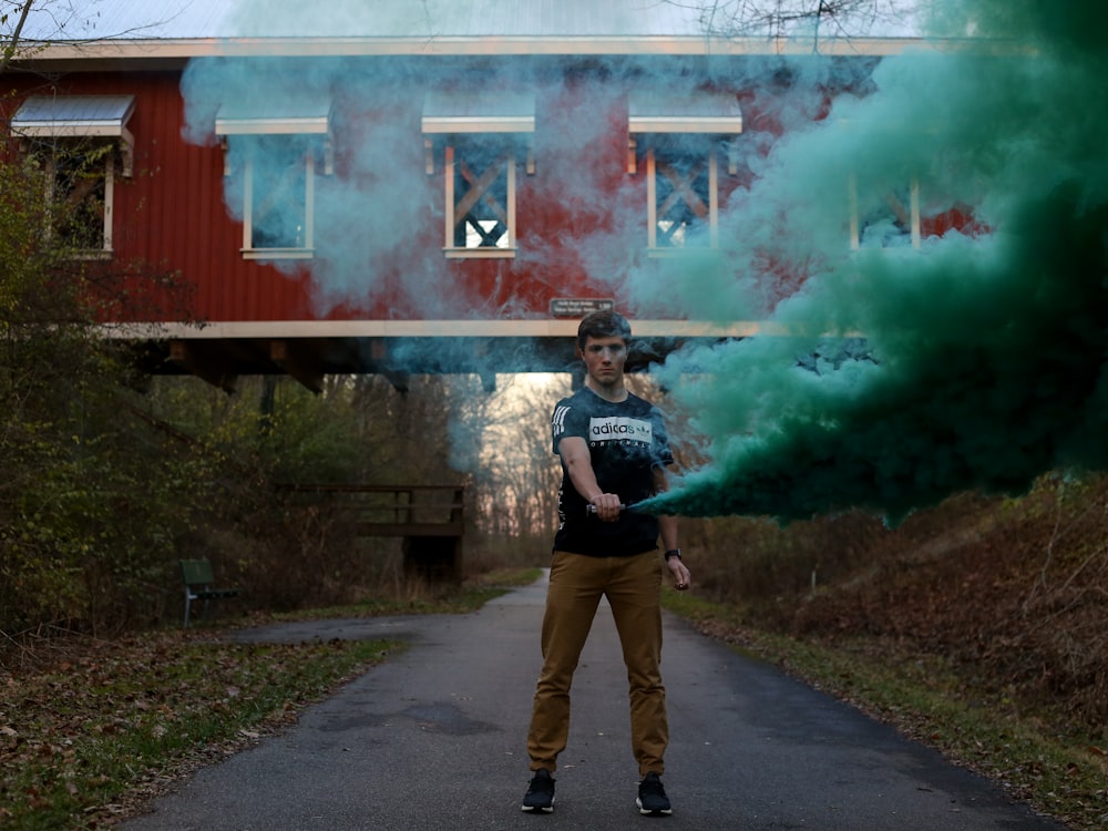 person surrounded by green smoke