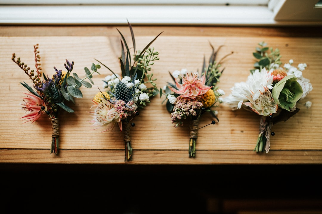 four flower bouquets on a table