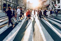 group of people walking on pedestrian lane