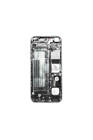 A disassembled view of a smartphone displaying its internal components such as the circuit board, battery compartment, and various connectors. The phone case is removed, exposing the intricate layout of electronic parts.