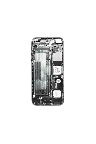 A disassembled view of a smartphone displaying its internal components such as the circuit board, battery compartment, and various connectors. The phone case is removed, exposing the intricate layout of electronic parts.