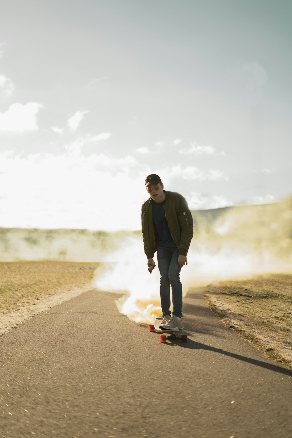 photo of man riding longboard