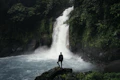 Waterfall with hiker silhouette