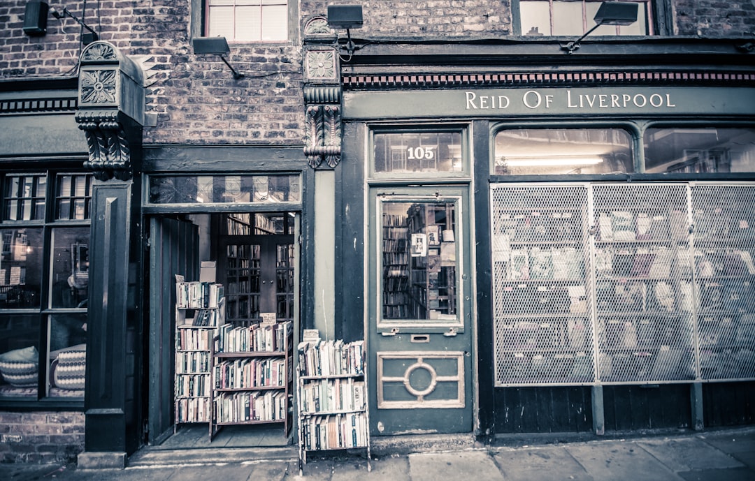 grayscale photo of Reid of Liverpool store signage at daytime, Old book shop in Liverpool