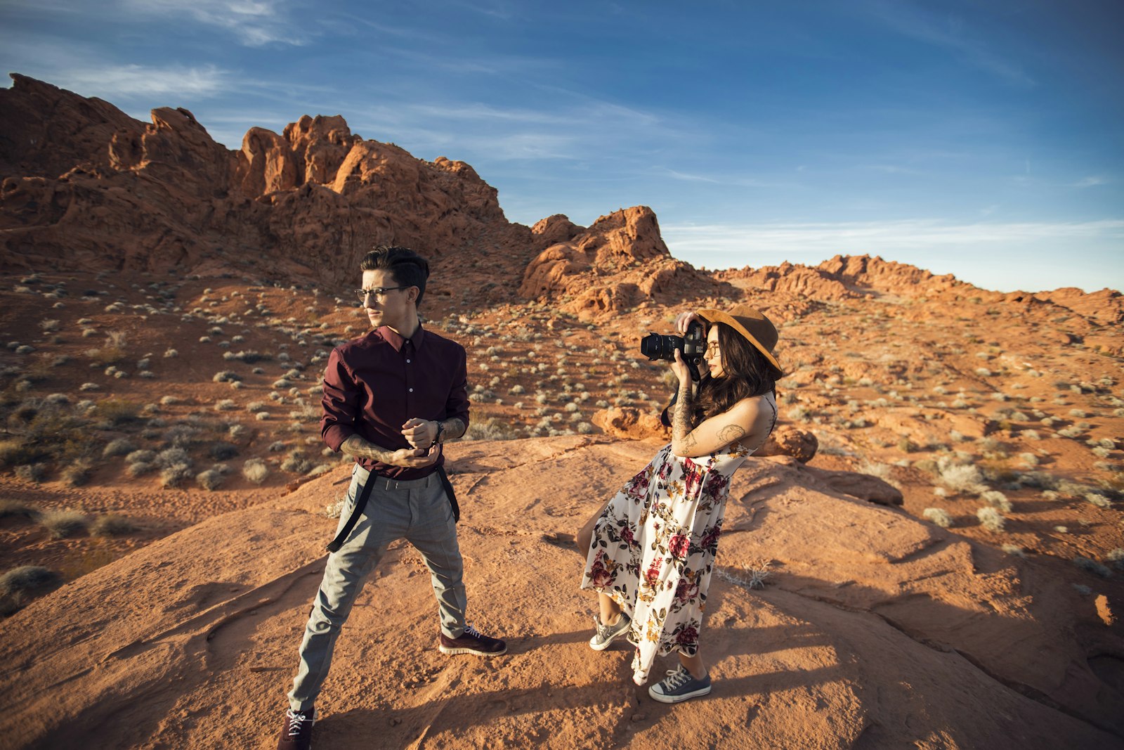 Canon EOS-1D X Mark II + Canon EF 16-35mm F2.8L II USM sample photo. Woman holding camera while photography