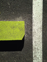 Cleaned and pressure-washed driveway with neon green highlights on the edges.