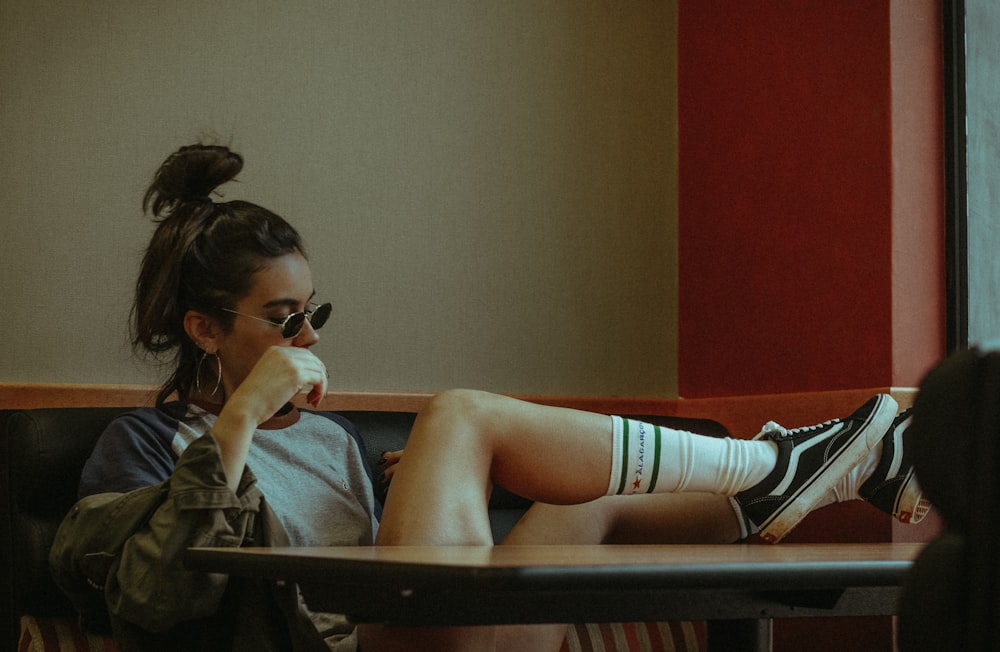 woman sitting on couch