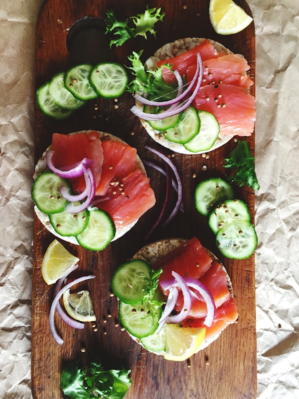 Raw fish filet with vegetable and spices on chopping board