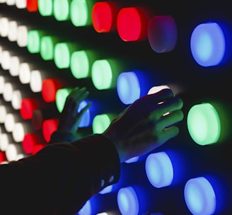 people holding assorted-color LED lights