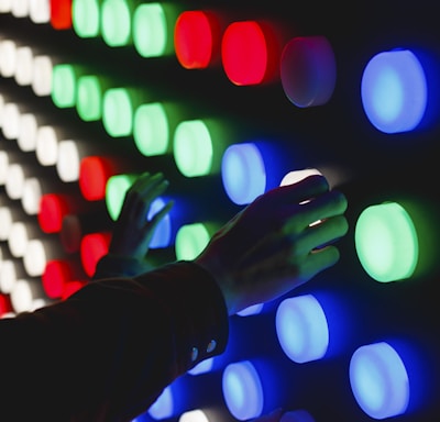 people holding assorted-color LED lights