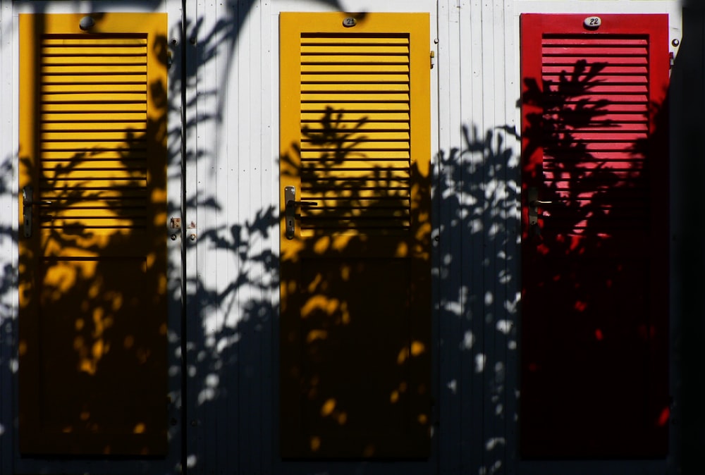yellow and red wooden closed doors