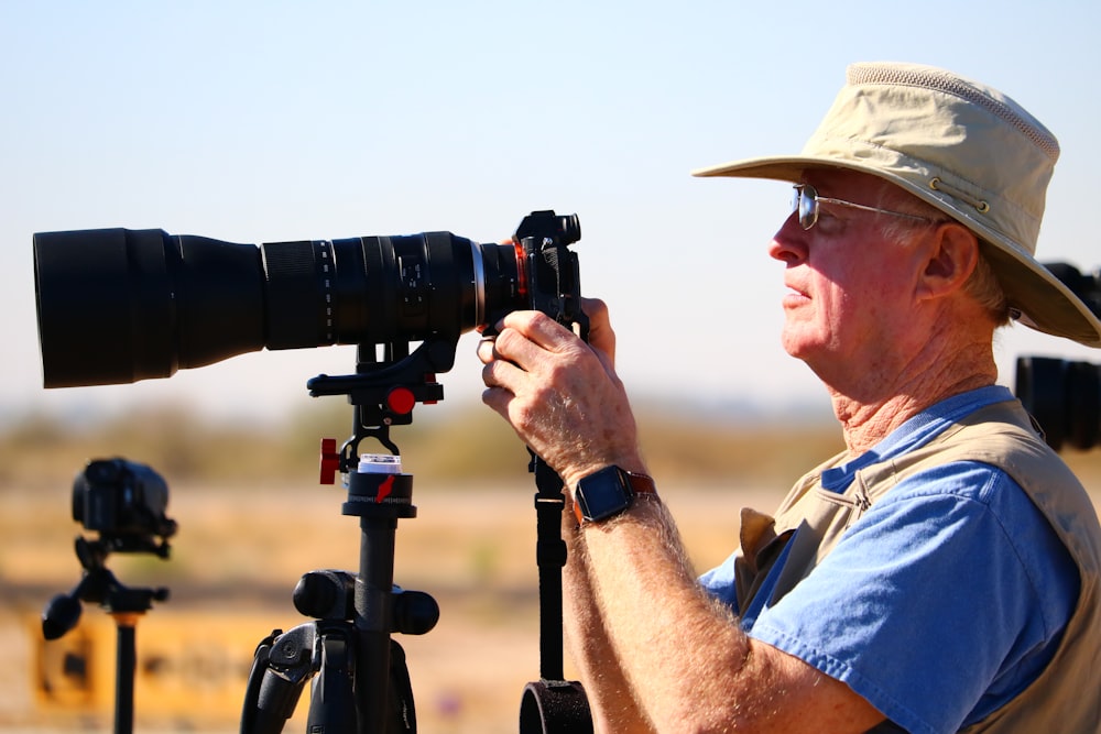 man holding DSLR camera