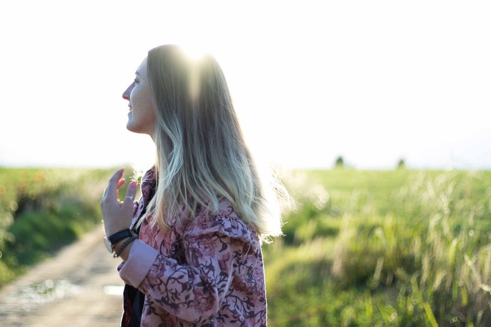 woman posing under sunny sky