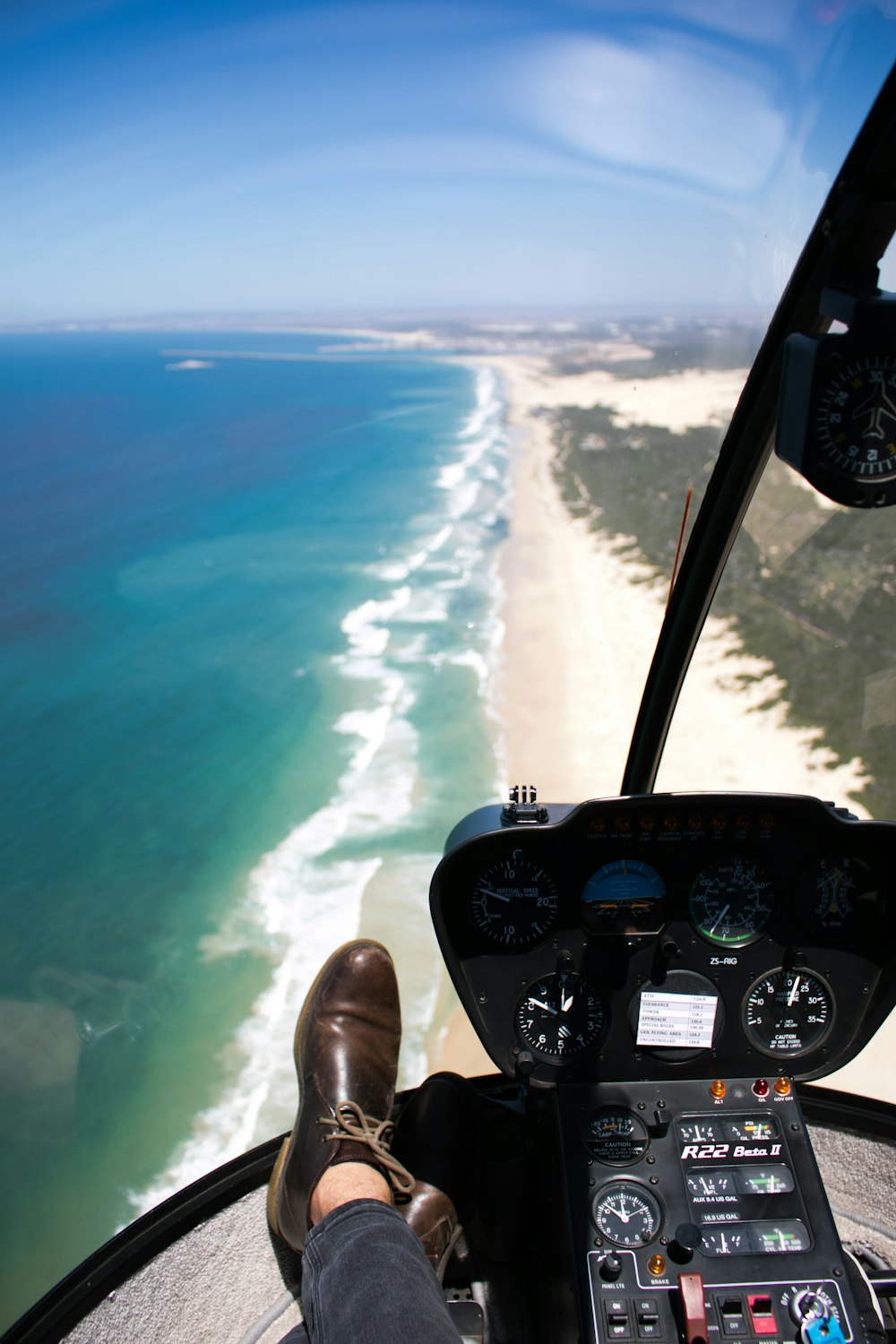 person inside aircraft over beach