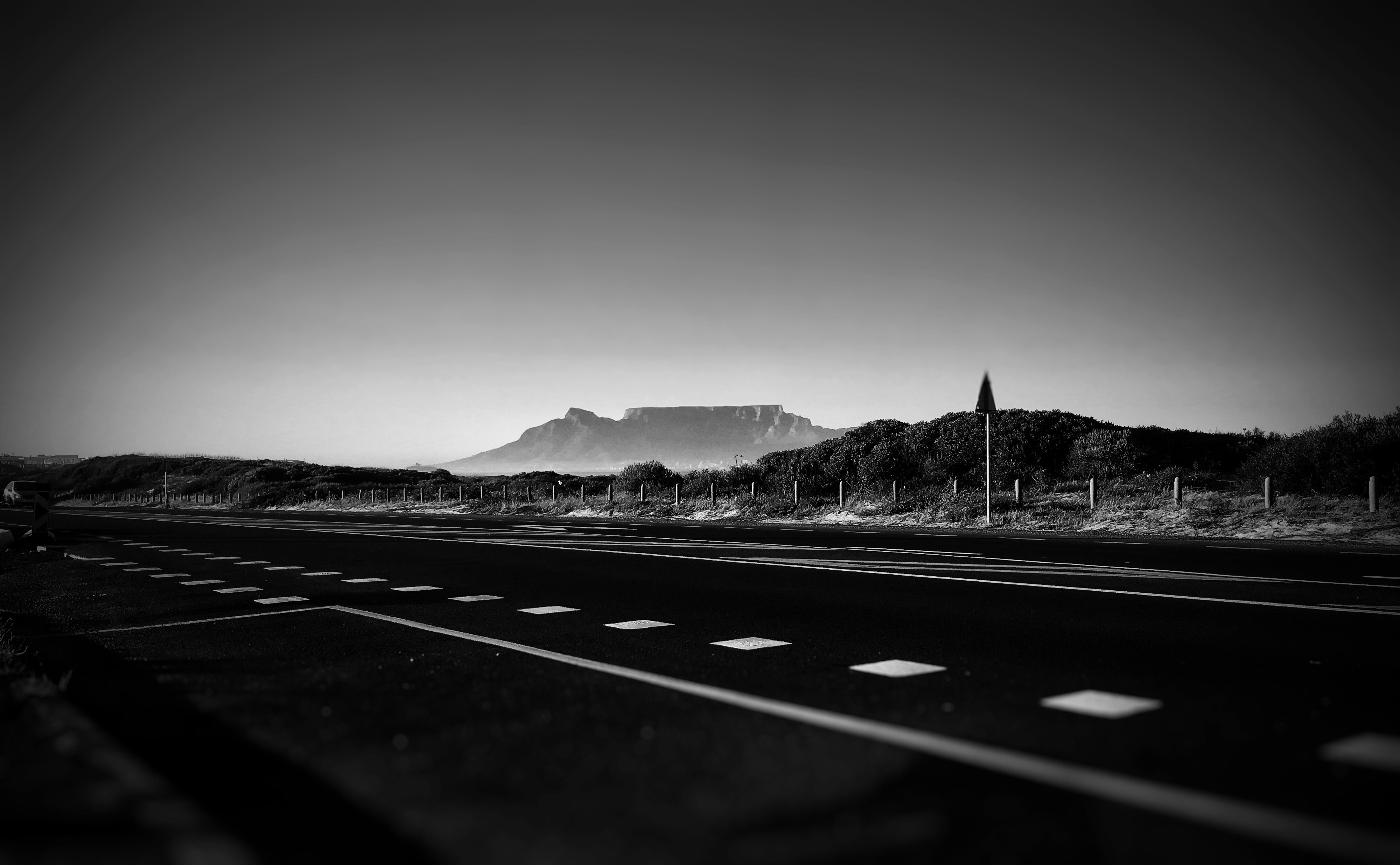 empty road in grayscale photography