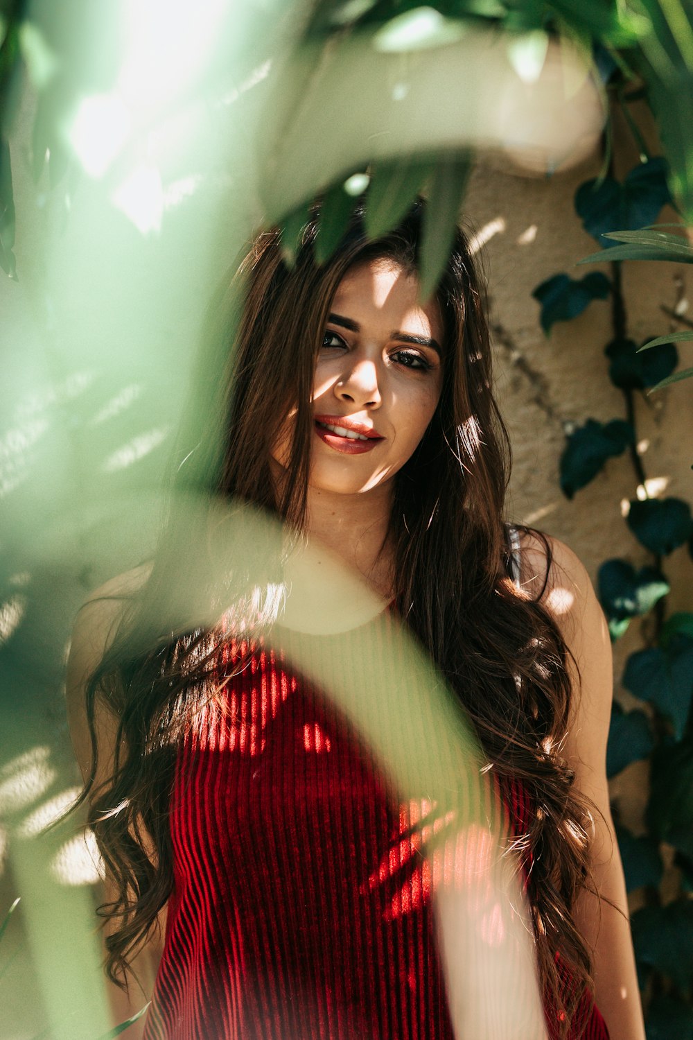 selective focus photography of woman wearing red camisole