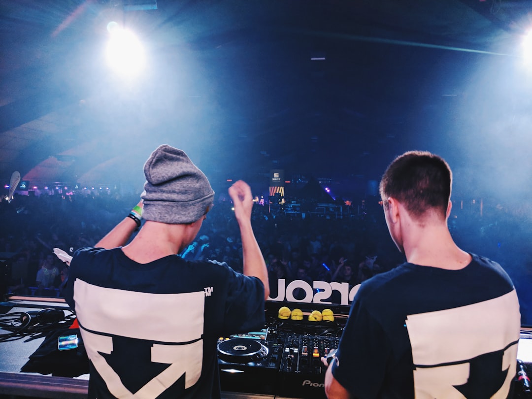 DJ in front of the crowd, Attending a concert of We AM playing at Wintersound Festival 2018 in Delemont, Switzerland from a backstage perspective.