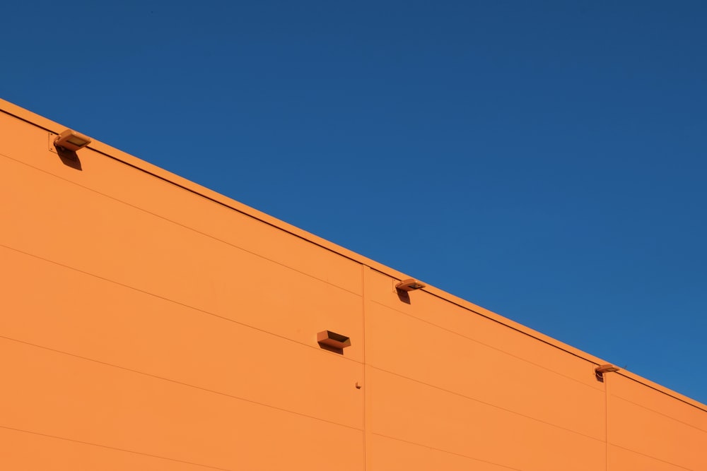 architectural photography of orange concrete structure