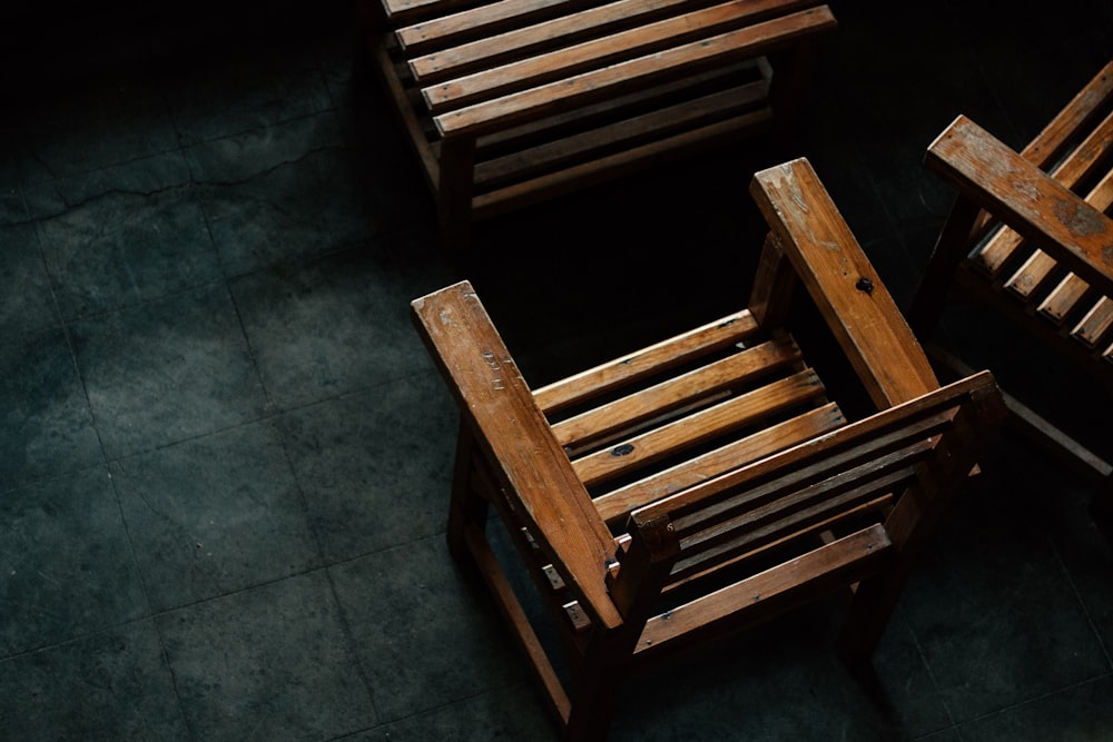 brown wooden armchairs on floor tiles