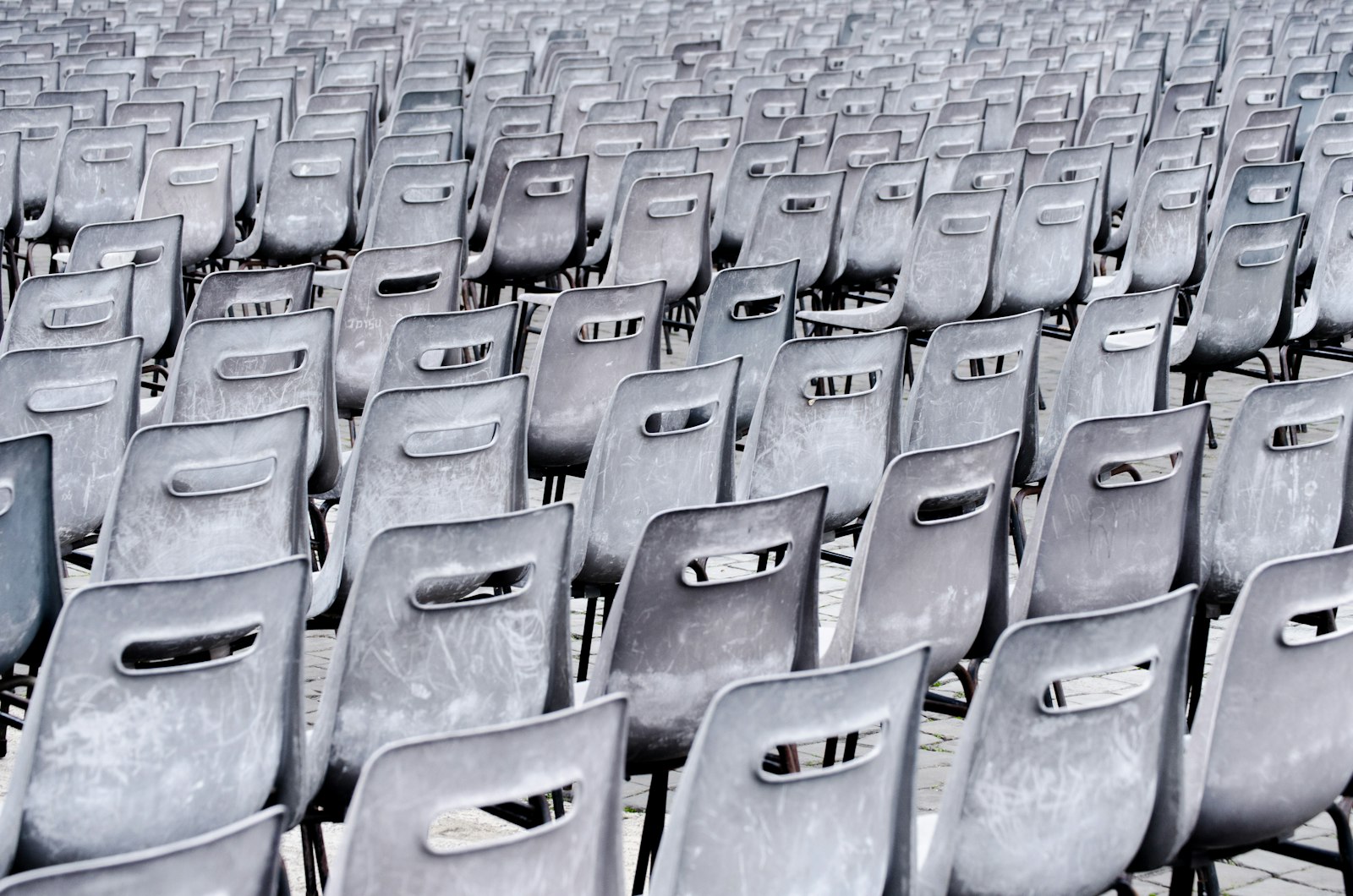 Nikon D7000 + Nikon AF-S DX Nikkor 55-200mm F4-5.6G ED sample photo. Gray chairs lined up photography