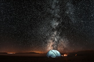 blue tent under milkyway powered with solar panels