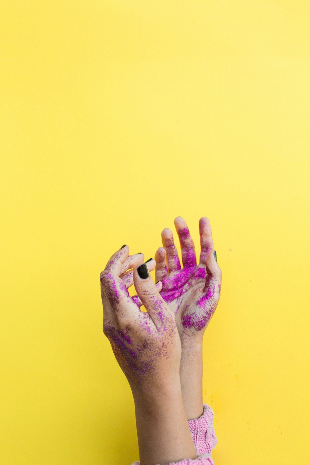 person showing pink painted both hands