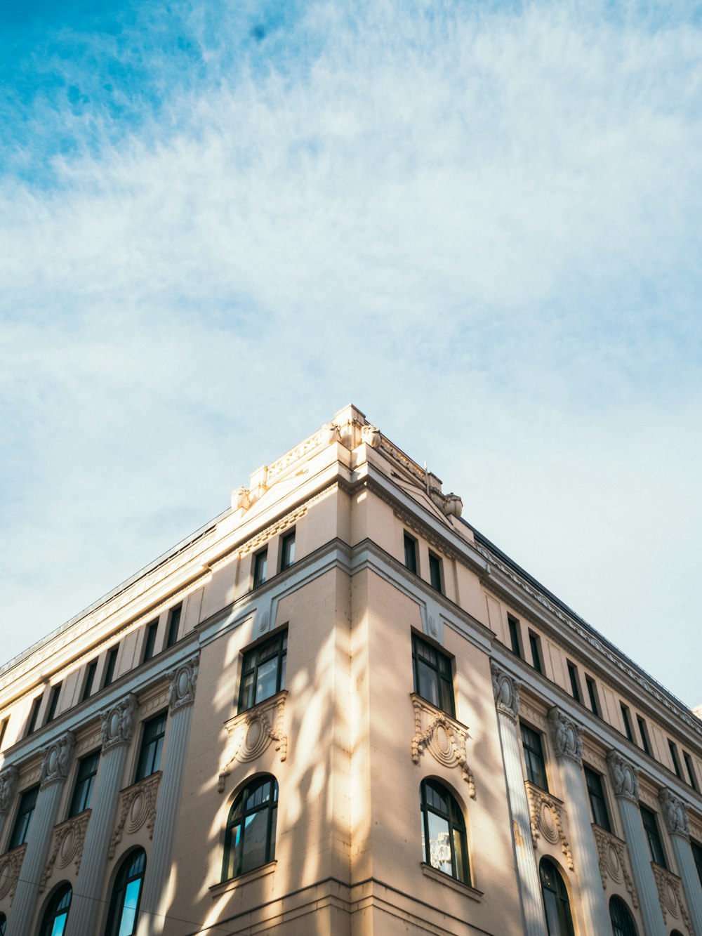 low-angle photography of brown and beige concrete building