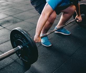 person about to lift barbell