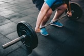 person about to lift barbell