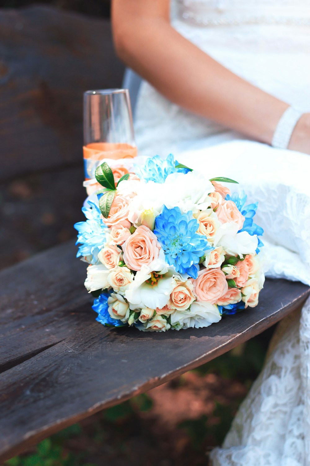 assorted-color flowers bouquet on bench