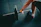 man holding black barbell