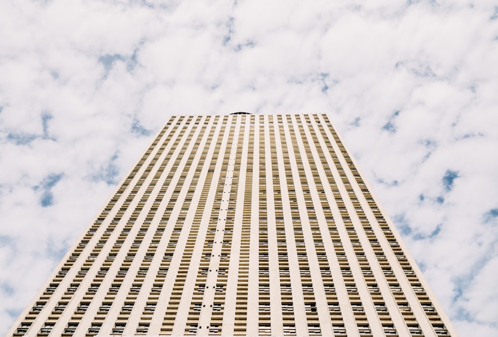 low-angle photography of yellow concrete building