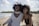 photo of woman beside another woman at seashore