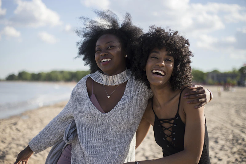 woman beside another woman at the seashore