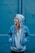 woman standing near blue steel gate