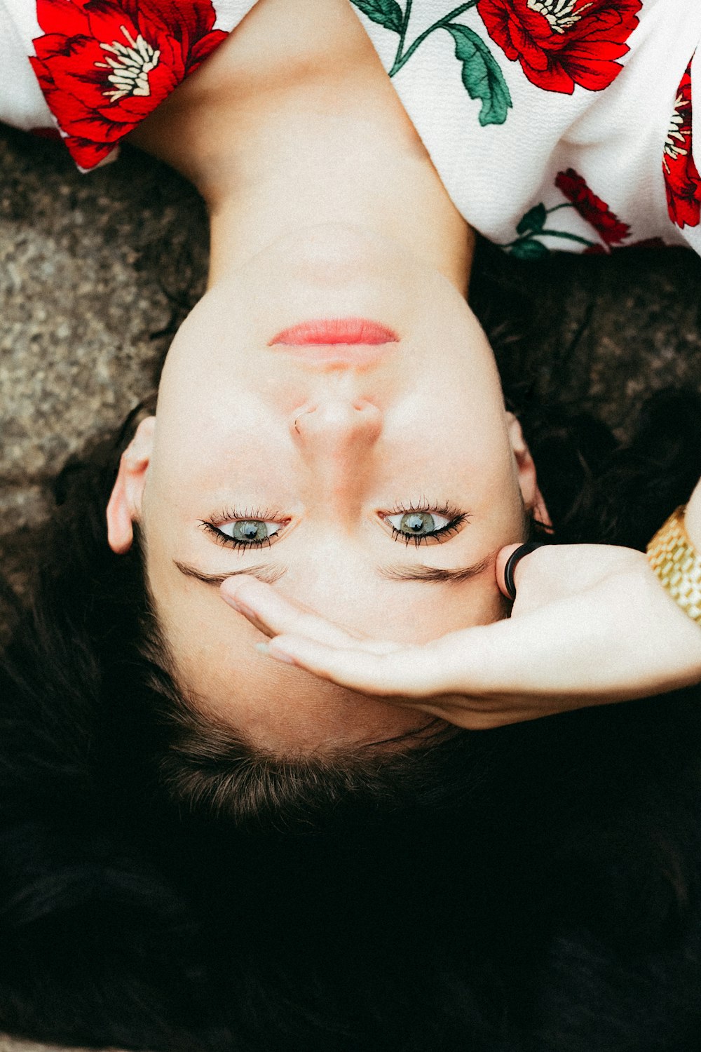 woman lying on brown surface