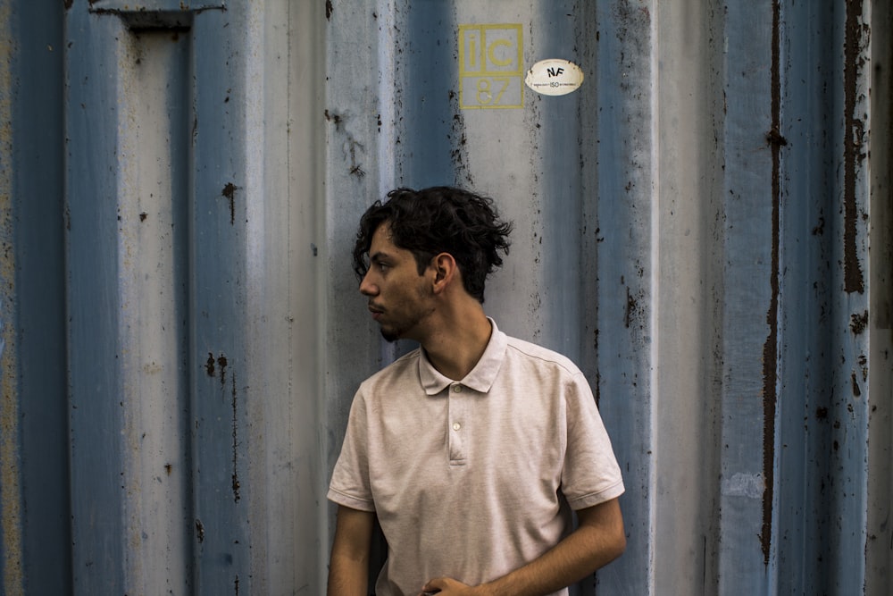 photo of man wearing beige polo shirt