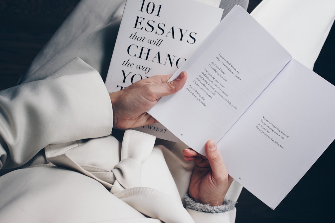 person holding book, These books are both by the author Brianna Wiest