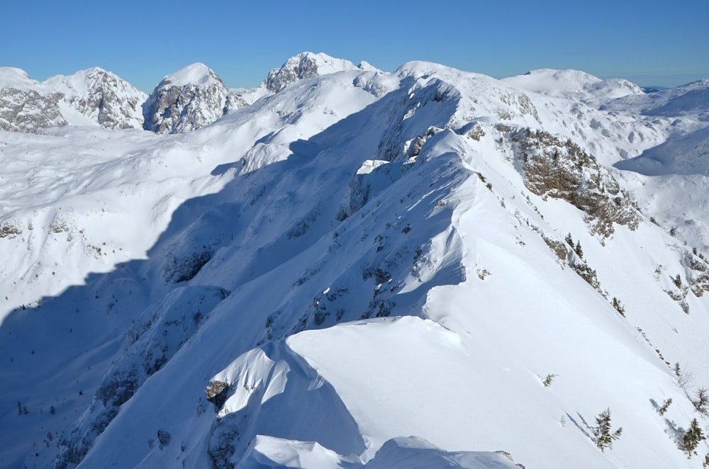 photo of glacier mountain under blue sky