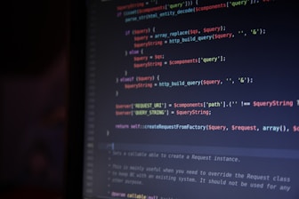 A computer screen is displaying lines of colorful code. The syntax is highlighted in different colors, with keywords in red, operators in blue, and strings in green. The code appears to involve data query and replacement functions.