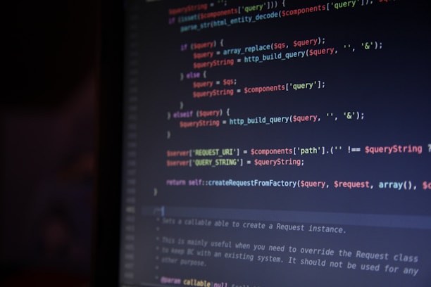 A computer screen is displaying lines of colorful code. The syntax is highlighted in different colors, with keywords in red, operators in blue, and strings in green. The code appears to involve data query and replacement functions.