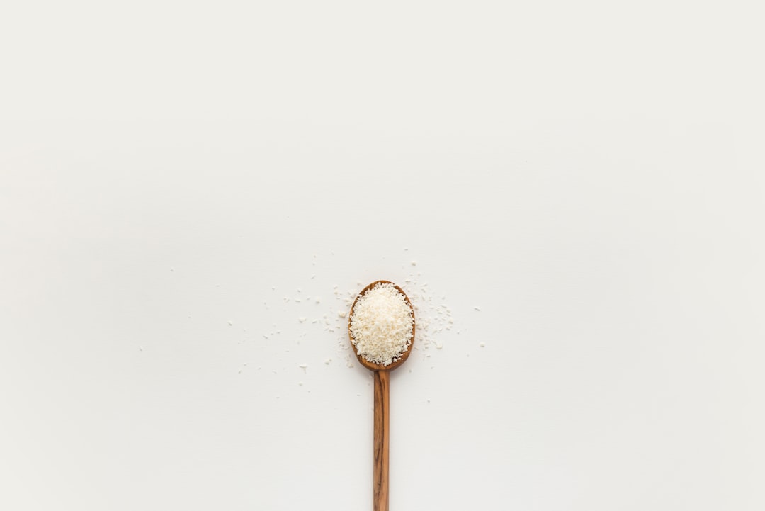 white powder on brown wooden spoon